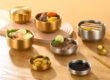 stainless steel bowl with silver and gold lid