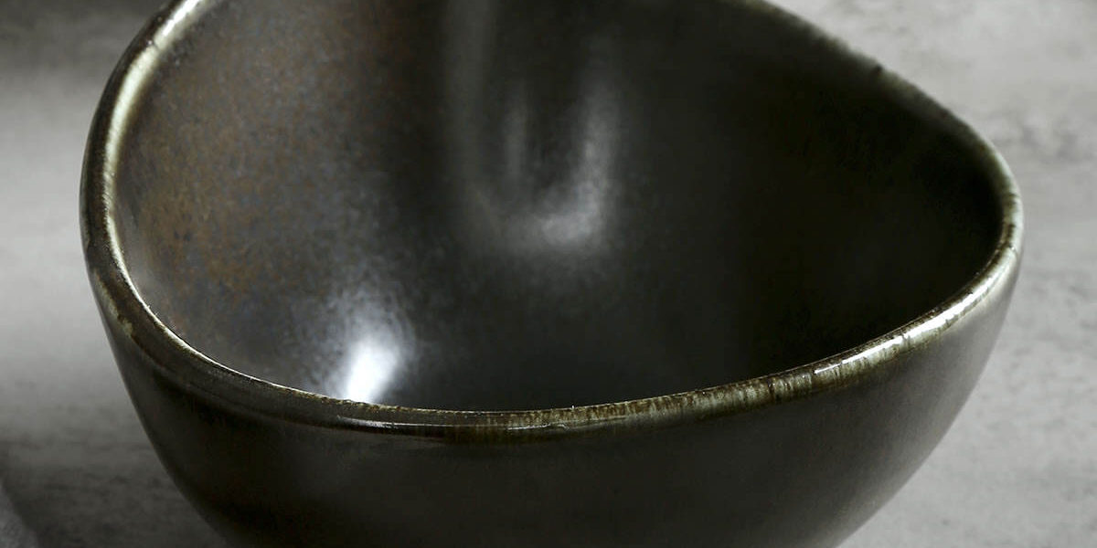 Matte black ceramic bowl with porcelain