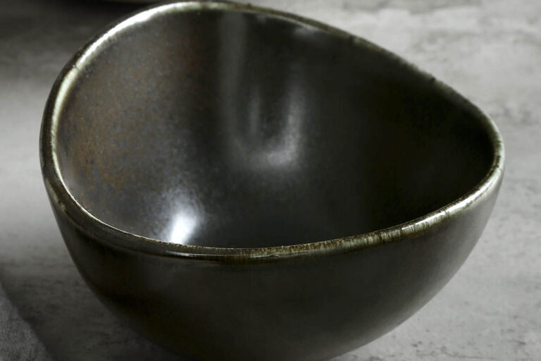 Matte black ceramic bowl with porcelain