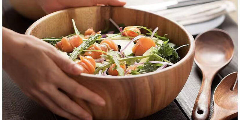 wood salad bowl with wooden spoon