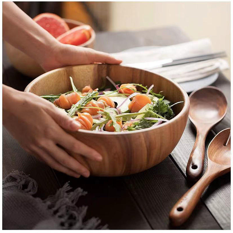wood salad bowl with wooden spoon